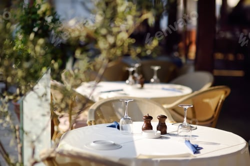Preview: Table set in stylish outdoor cafe.