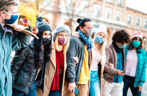 Preview: Millennial people group walking and having fun together wearing face mask