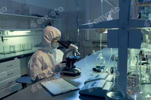 Preview: Scientist examining bacterium through the microscope