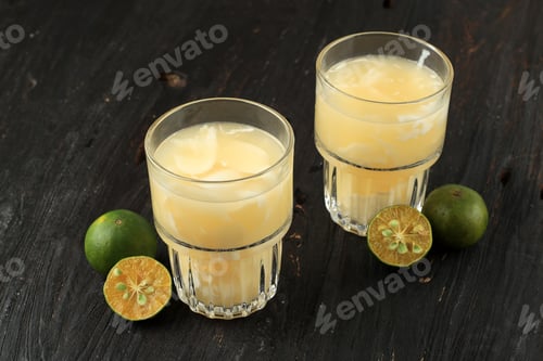 Preview: Es Kelapa Jeruk or Young Coconut with Squeezed Orange, Indonesian Tropical Refreshment Drink