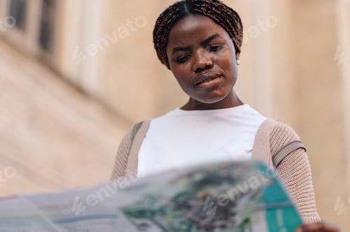 Preview: Tourist reading city map while exploring new destination