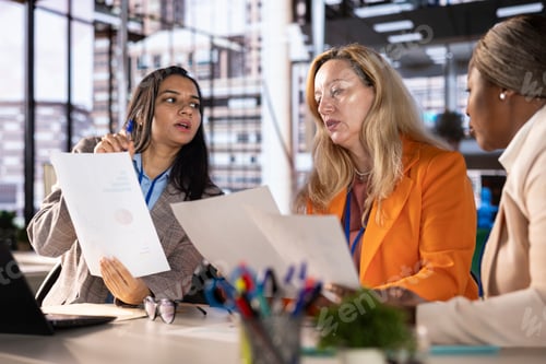 Preview: Diverse team of empowered women executives discussing corporate strategy