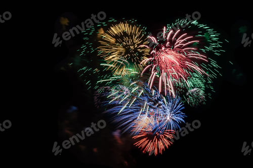 Preview: Multicolored fireworks heart in black sky, copy space