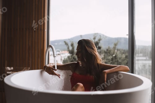 Preview: Woman in a modern bath tub