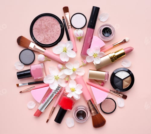 Preview: Decorative cosmetics with apple blossom on a pastel pink backgro