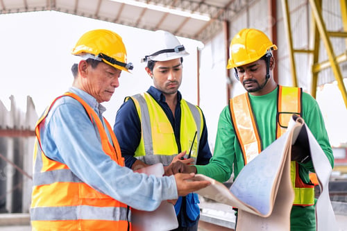 Preview: At construction site engineer check drawing correctness concrete mold before pouring concrete