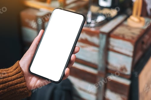 Preview: Mockup image of hand holding black mobile phone with blank desktop screen