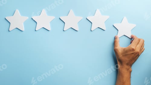 Preview: Experience customer feedback, hand placing fifth star, indicating positive review, conveying