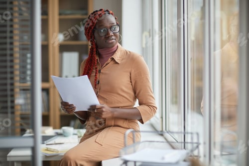 Preview: Young African Businesswoman by Window