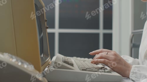 Preview: Woman working with an old computer