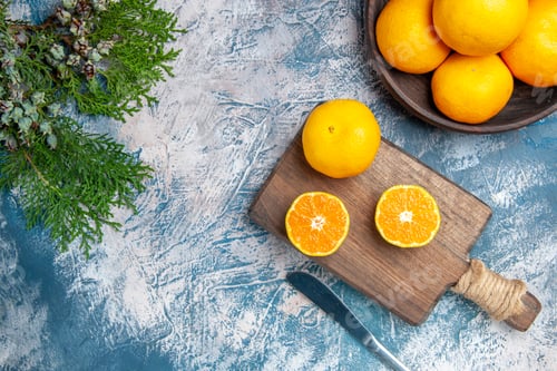 Preview: top view fresh tangerine slices on light-blue background citrus juice tree color photo fruit