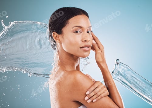 Preview: Face portrait, skincare and water splash of woman in studio isolated on a blue background mockup. S