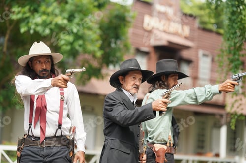Preview: Brutal cowboy with revolver, gunfight on ranch, rural background.
