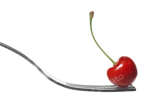Fresh Red Cherry on a Silver Fork
