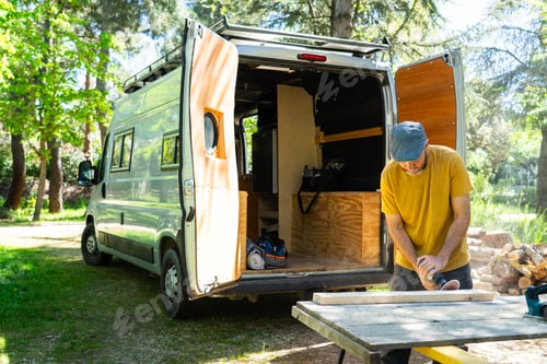 Preview: Man working camperizing a camper van