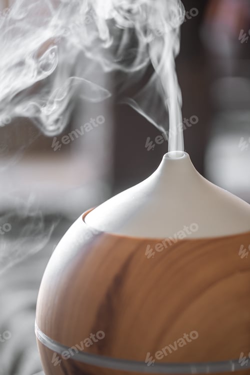 Preview: Modern oil aroma diffuser close up on a blurred background.