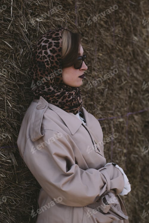 Preview: Woman Posing in Front of Hay Bale Outdoors