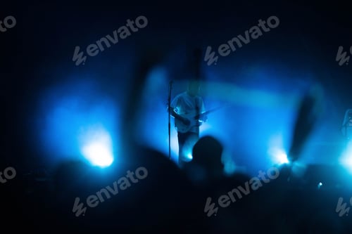 Preview: singer silhouette in stage lights live concert
