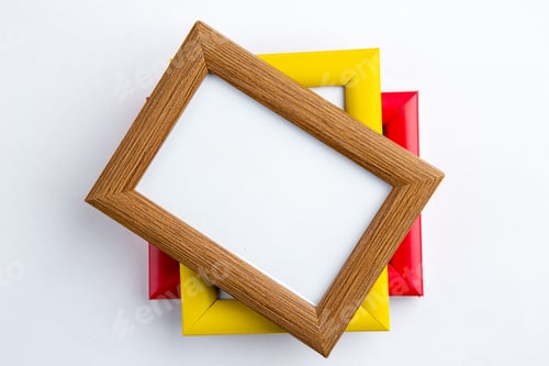 Preview: Close up view of three empty picture frames on white background with free space