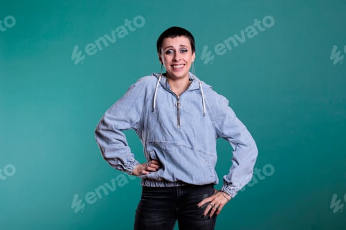 Preview: Smiling stylish brunette woman with short hair and gorgeous makeup wearing casual clothes