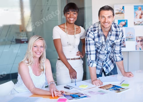 Preview: Design is our passion. Two young designers standing in their studio surrounded by pictures.