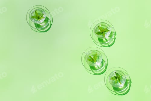 Preview: Relaxing mint tea on green background, trendy light and shadow