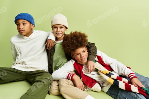 Preview: Joyful moments shared by little boys in vibrant attire showcasing friendship and style