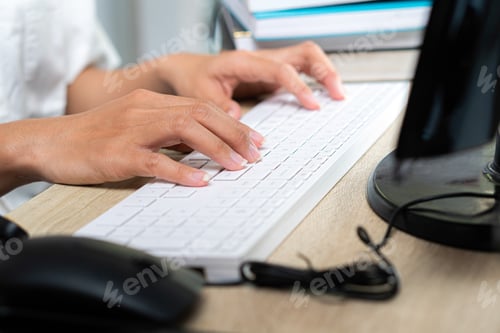 Preview: businesswoman with laptop computer and papers working at office