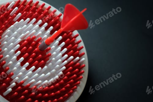 Preview: Dartboard with dart arrow hitting the center