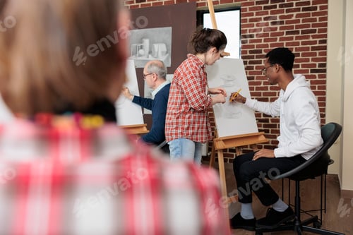 Preview: Artist teacher explaining drawing process to young student