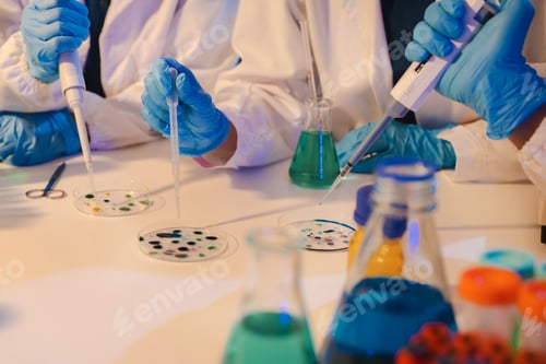 Preview: Scientist mixing chemical liquids in the chemistry lab.
