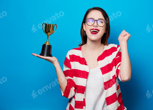 Preview: young smiling woman with cup trophy