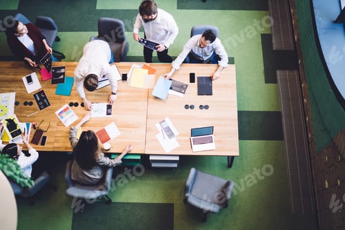 Preview: Group of creative modern workers in conference rom
