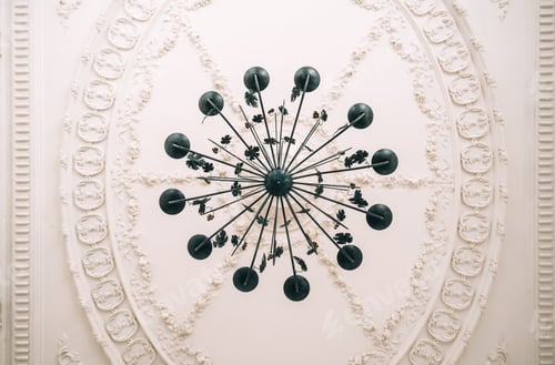 Preview: Beautiful vintage chandelier in the living room with ornamental ceiling.