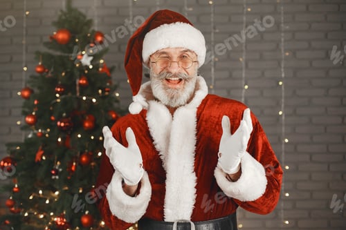 Preview: Man in santa claus costume looking at the camera