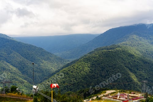 Preview: Green hill mountain range on cloudy day in Russia