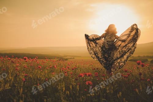 Preview: Young beautiful woman in spring field