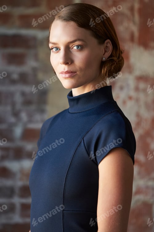 Preview: Head And Shoulders Portrait Of Young Businesswoman In Office