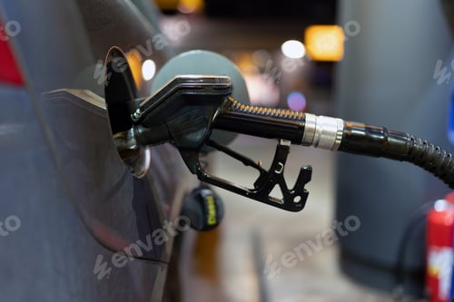 Preview: Fuel nozzle filling up car with fuel