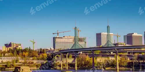 Preview: Construction cranes, bridge over the river and skyscrapers fill the Portland cityscape
