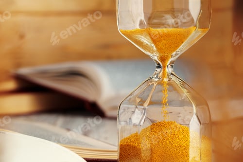 Preview: Hourglass with sand close up on wooden background