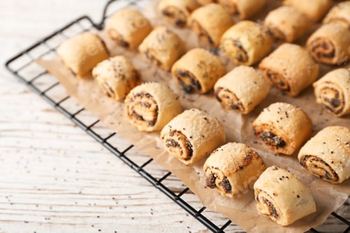 Preview: Tasty sweet cookies with poppy seeds on wooden table