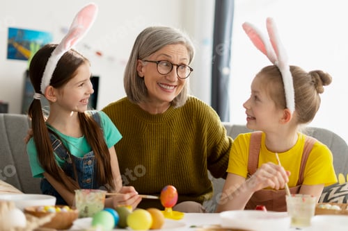Preview: Grandmother and Granddaughters Painting Easter Eggs Together