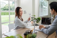 Preview: ESG Business Meeting. Professionals discussing sustainability and renewable energy solutions.