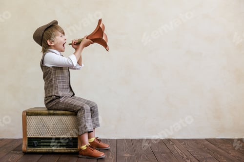 Preview: Newsboy shouting against grunge wall background. Boy selling newspaper