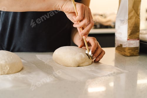 Preview: Woman preparing sourdough bread at home