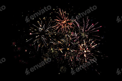 Preview: traditional festive fireworks in dark night sky, isolated on black