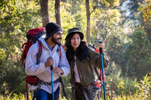 Preview: Happy Travelers Hiking with Backpacks on the Beautiful Rocky Trail at Warm Sunny.