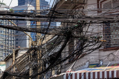 Preview: Phone cord on a pole, white building