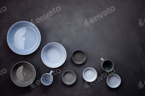 Preview: Top view of modern trendy plates in bleu and grey colors. Minimalistic Flat lay with tableware